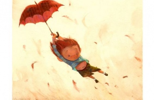 Un bambino vola con un ombrello a forma di cuore.