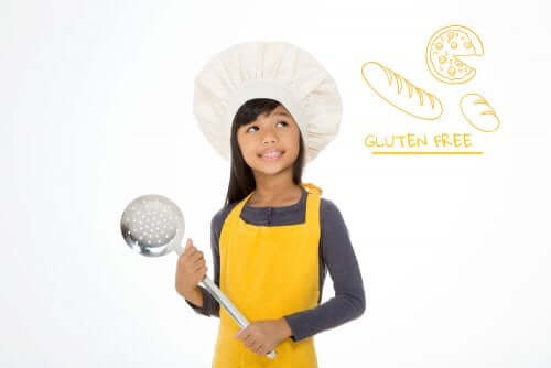 bambina vestita da cuoco con malattia celiaca